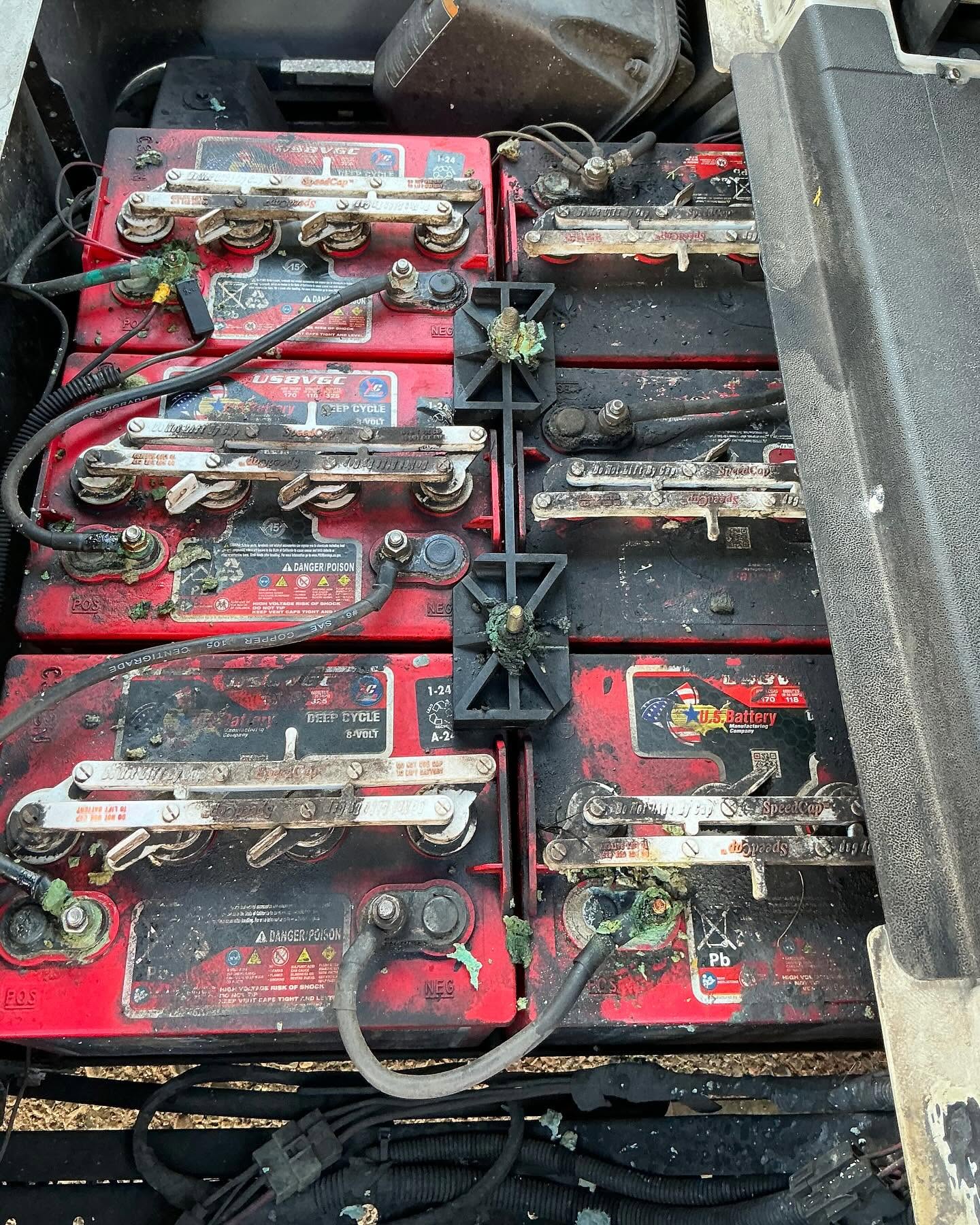 Golf cart battery compartment before battery service at Arizona Golf Cart Repair in Mesa